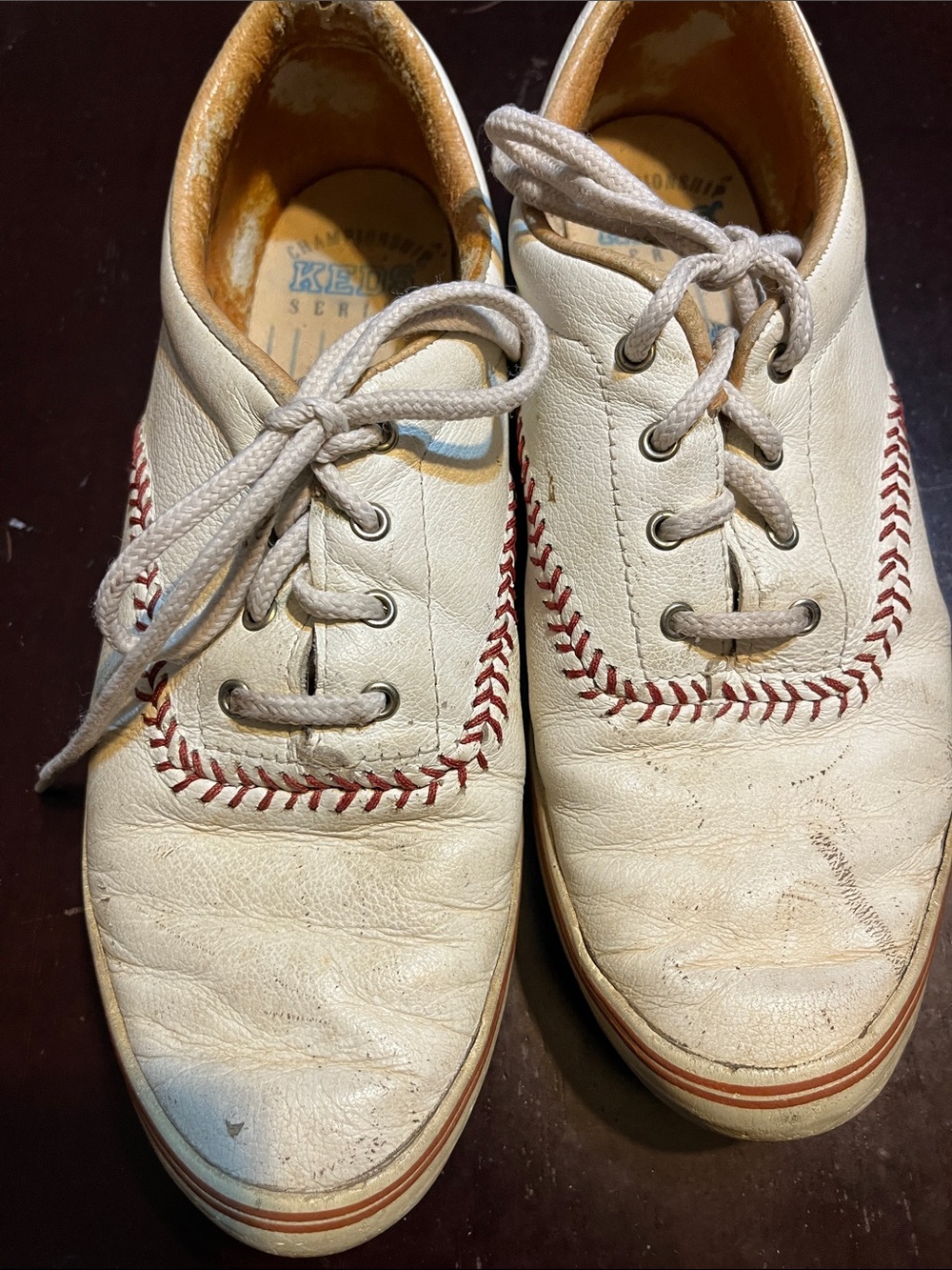 Keds White Leather Sneakers with Red Stitching